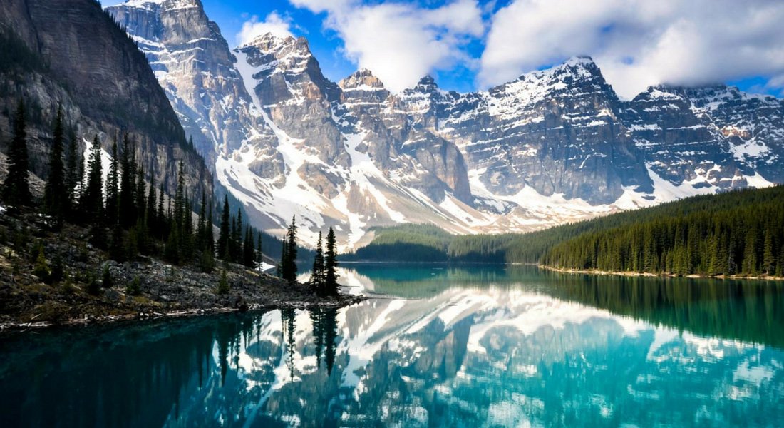 Tourists enjoying a scenic Canadian landscape, representing the boom in Canadian domestic tourism. (authentikcanada.com)